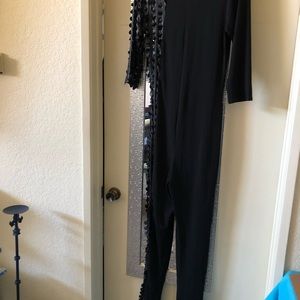 Jumpsuit with faux leather cut outs along the entire right side